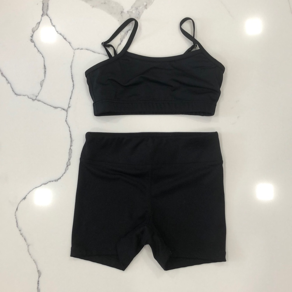 Black sports bra and biker shorts